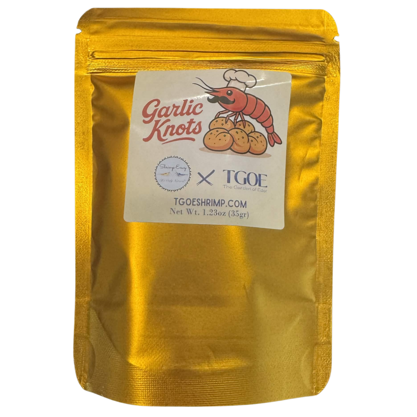 A 35g Shrimp Envy stand-up pouch of 'Garlic Knots' shrimp pellets, showing the front of the packaging on a white background.